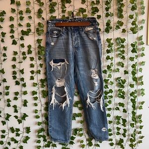Ripped, distressed, high waisted, straight leg gap jeans in a medium wash.
